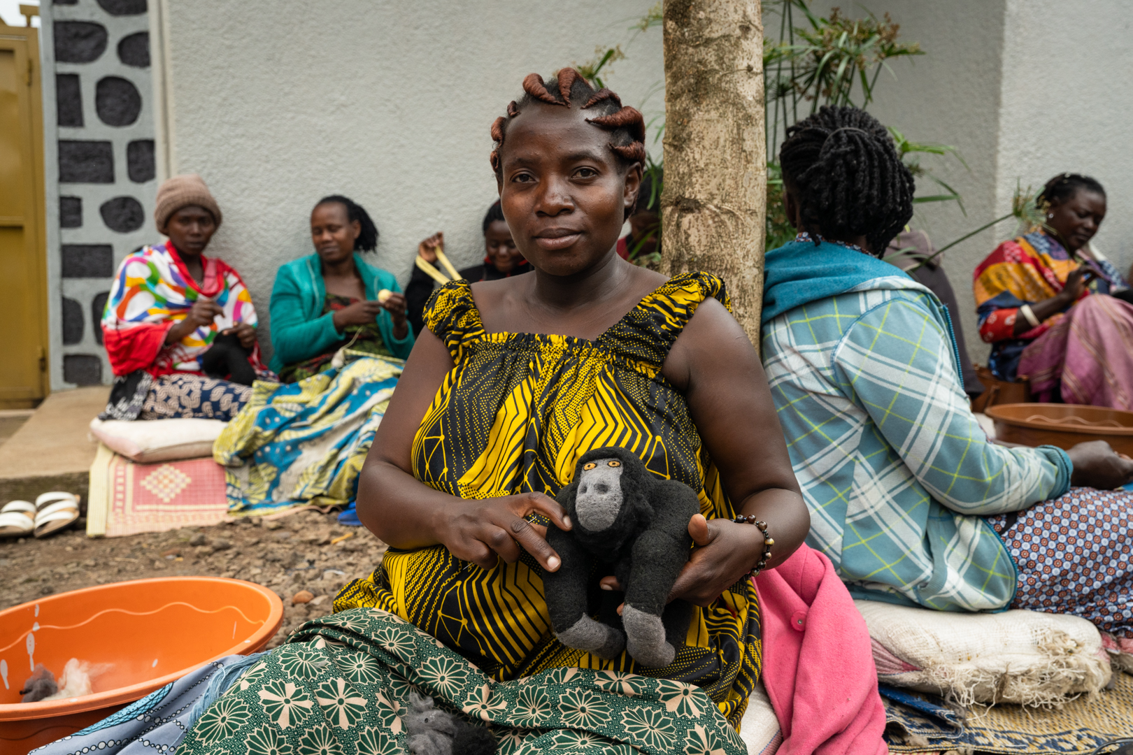 woman holding plush gorilla