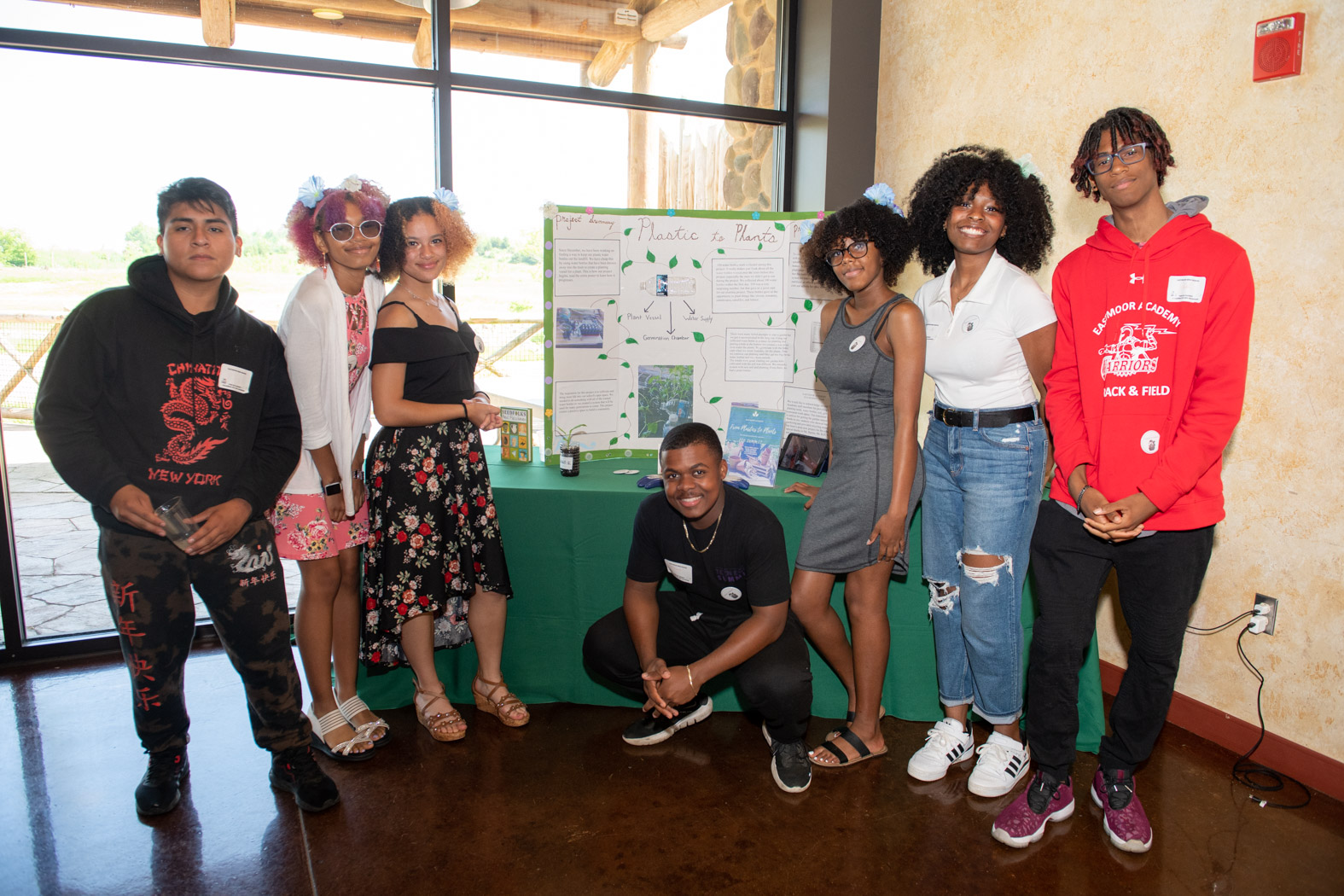 teens and sign at summit