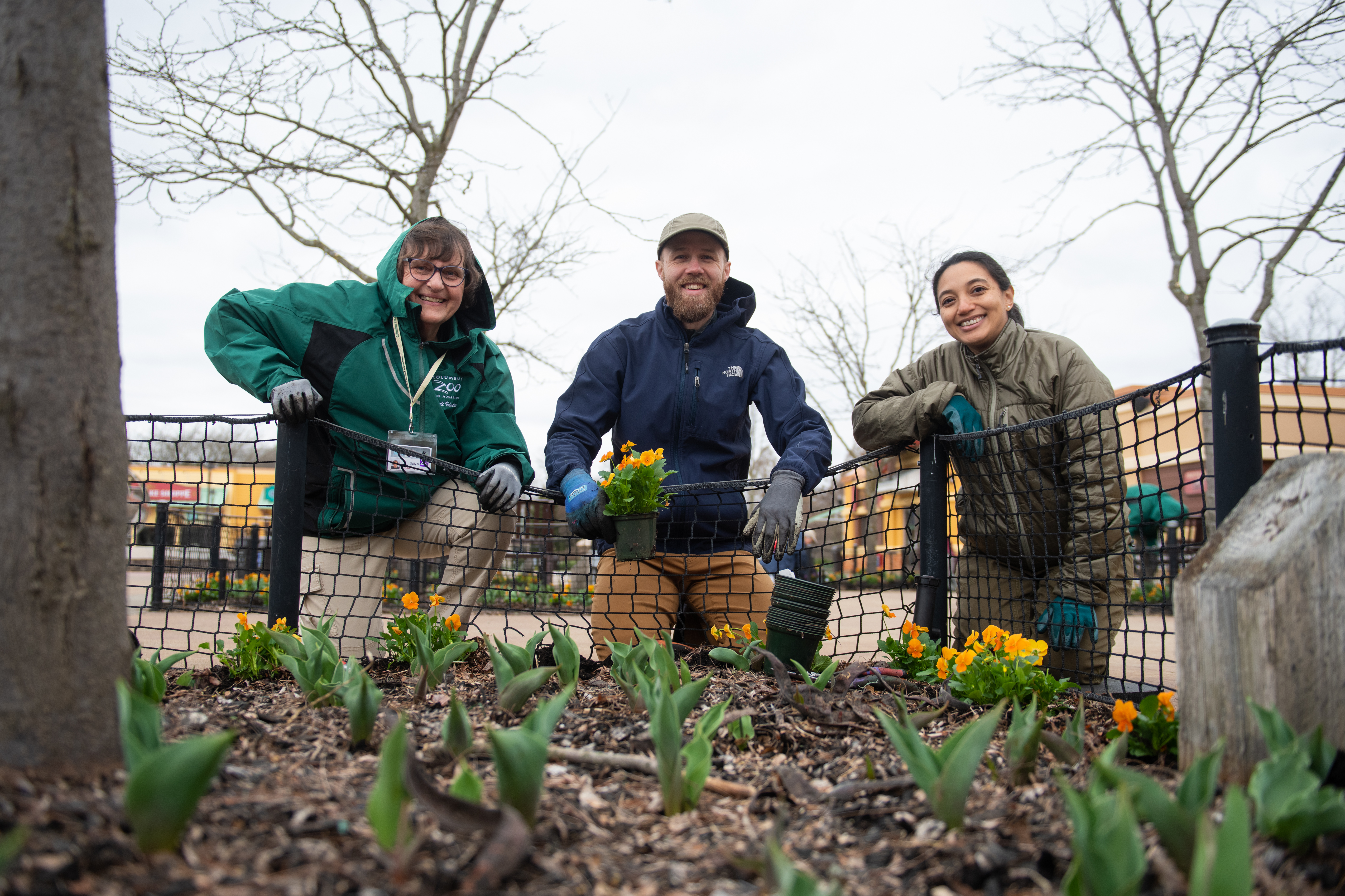 team members with flowers