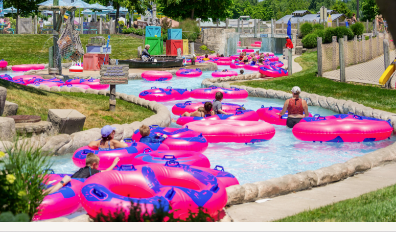 lazy river at waterpark with pink inner tubes