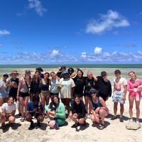 group of teenagers at the ocean