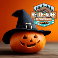 jack-o-lantern wearing witch hat with a campground logo in the background