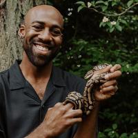 Jungle Jordan holding snake