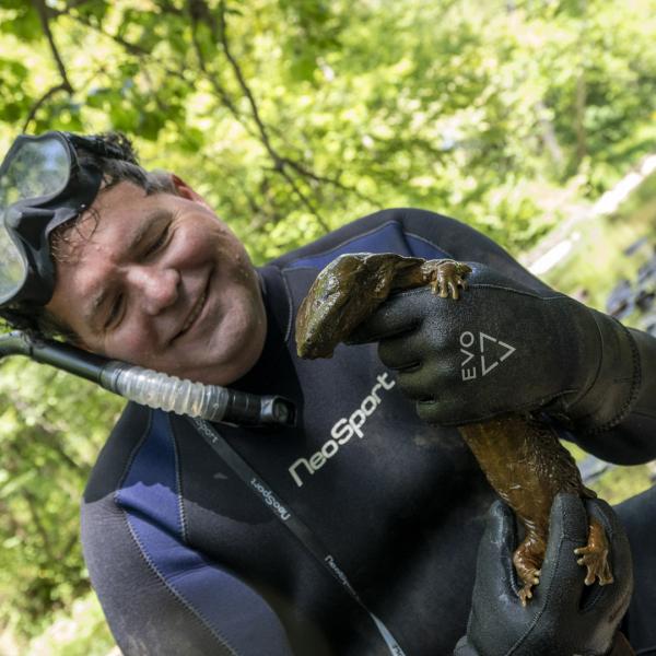 Greg Lipps holding hellbender