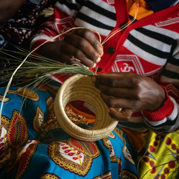 woman weaving basket