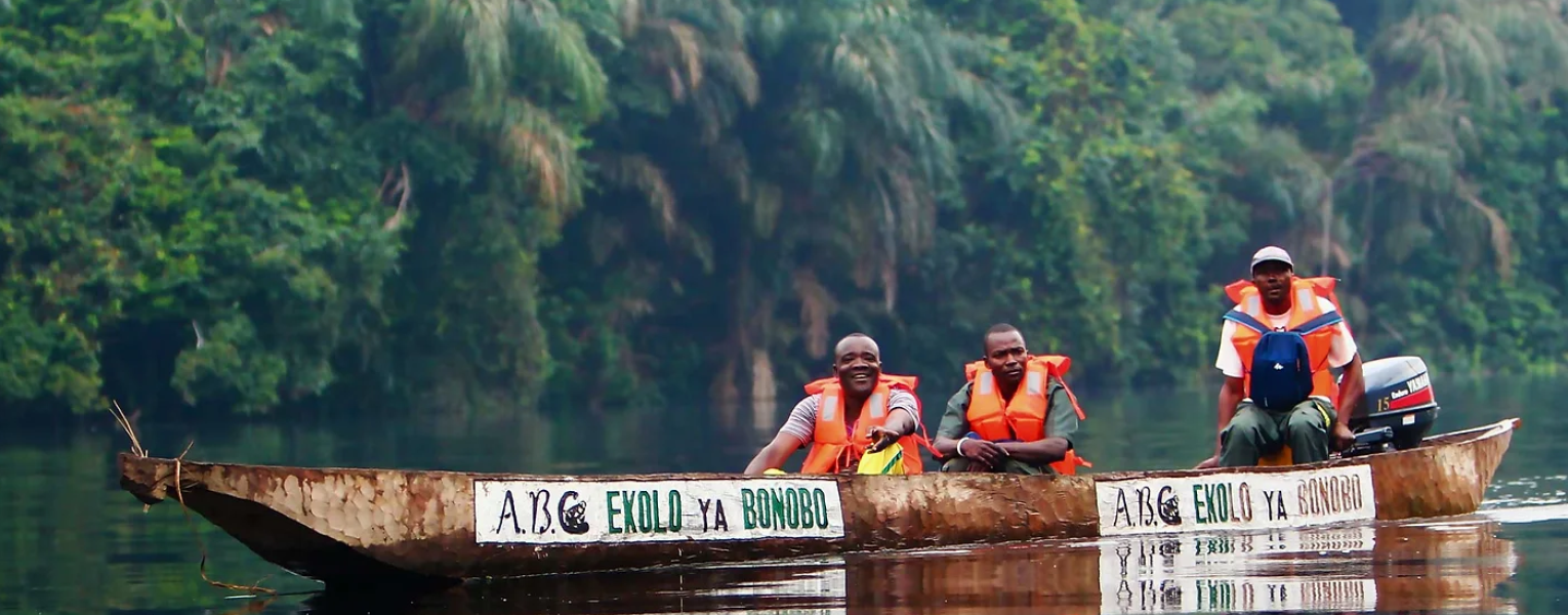 three people on boat in river